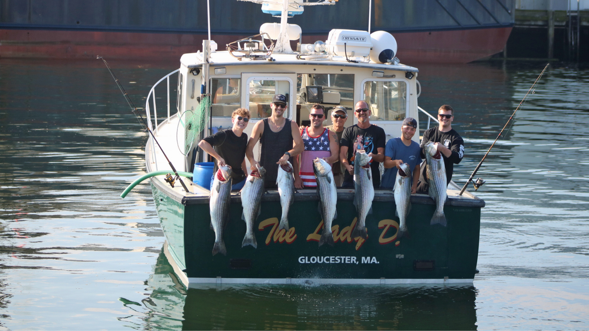 People on stern of Coastal Fishing Charters